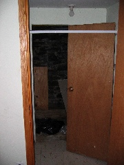 Basement (plumbing access) & broken door