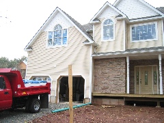 New house, old house in background