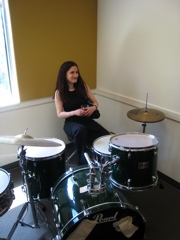 Sarah at the drums